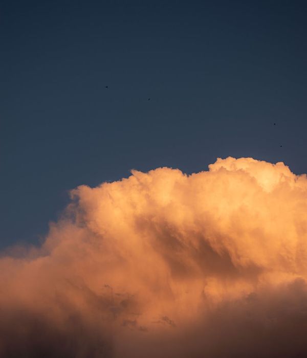 Man stretching outdoors with a serene landscape in the background, feeling refreshed.